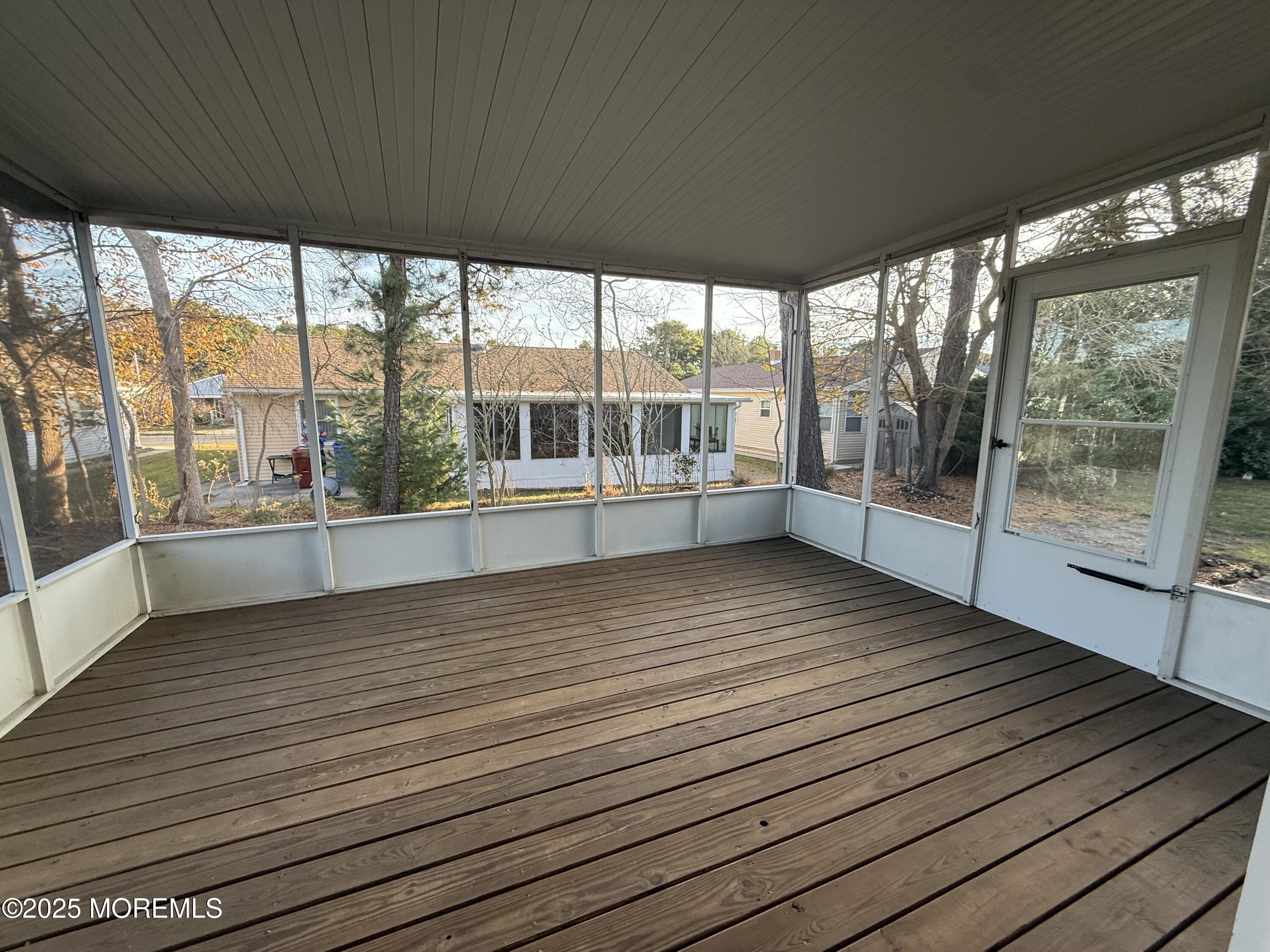 68 Virgin Islands Drive Toms River, NJ 08757 - Photo 10 of 19 a view of a room with wooden floor and windows