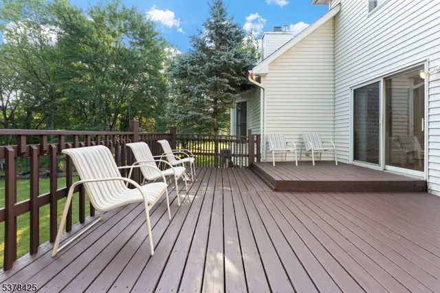 a view of a chairs and table on the deck