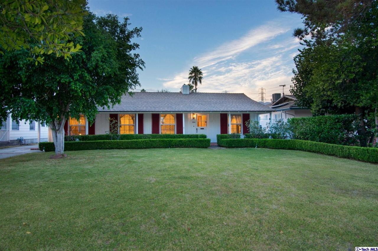 3263 Orlando Road Pasadena, CA 91107 - Photo 1 of 56 a front view of a house with a garden