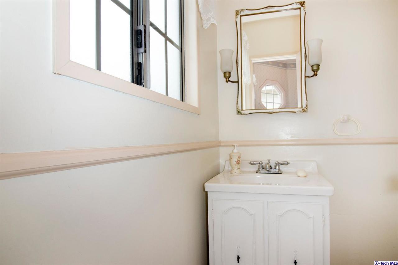 3263 Orlando Road Pasadena, CA 91107 - Photo 16 of 56 a bathroom with a sink and a mirror