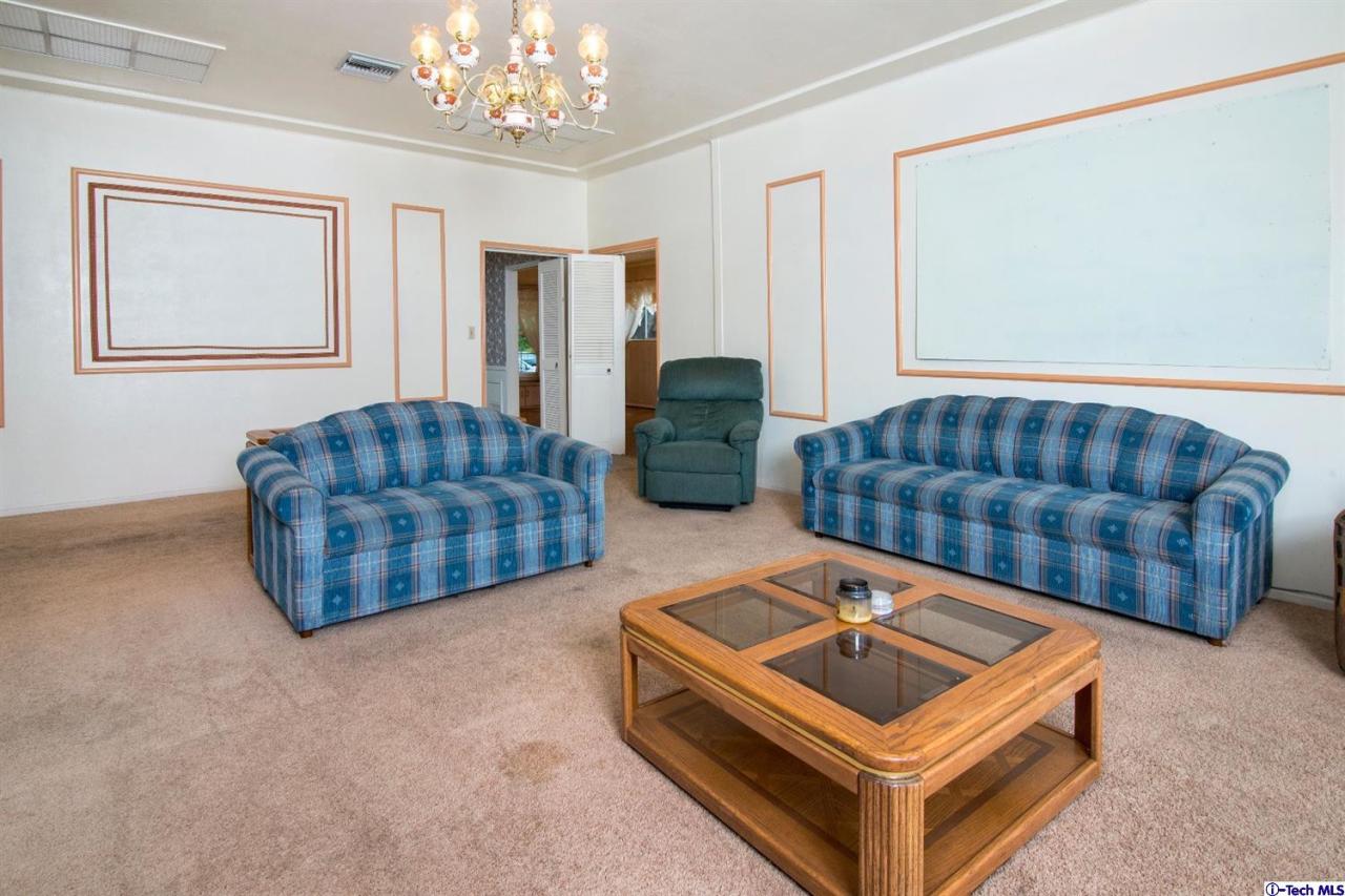 3263 Orlando Road Pasadena, CA 91107 - Photo 20 of 56 a living room with furniture and a chandelier