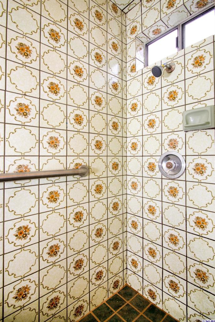 3263 Orlando Road Pasadena, CA 91107 - Photo 27 of 56 a bathroom with a shower curtain