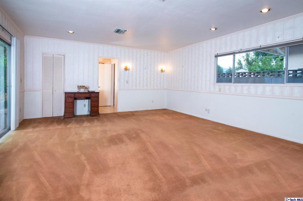 3263 Orlando Road Pasadena, CA 91107 - Photo 30 of 56 an empty room with a window and a kitchen