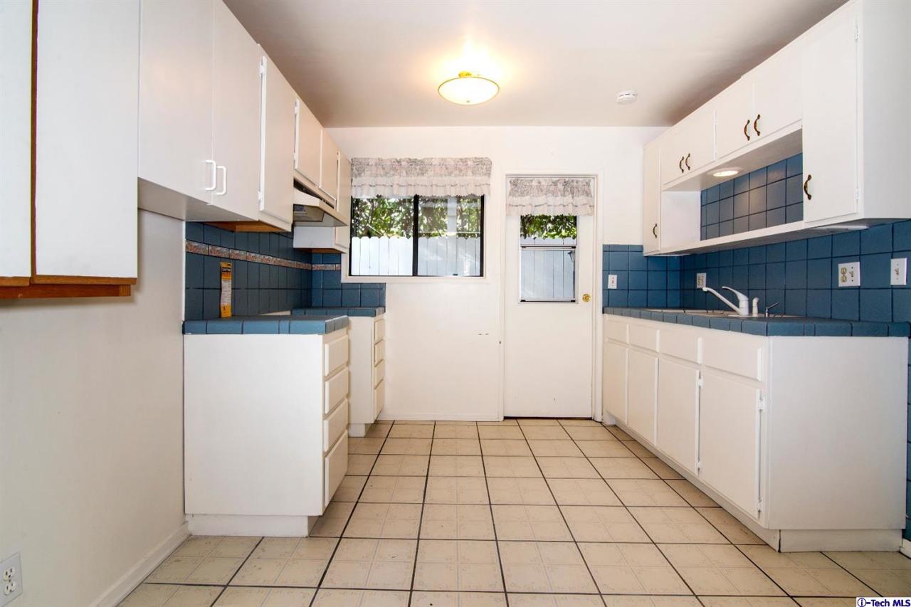 3263 Orlando Road Pasadena, CA 91107 - Photo 49 of 56 a kitchen with stainless steel appliances a refrigerator and a stove top oven