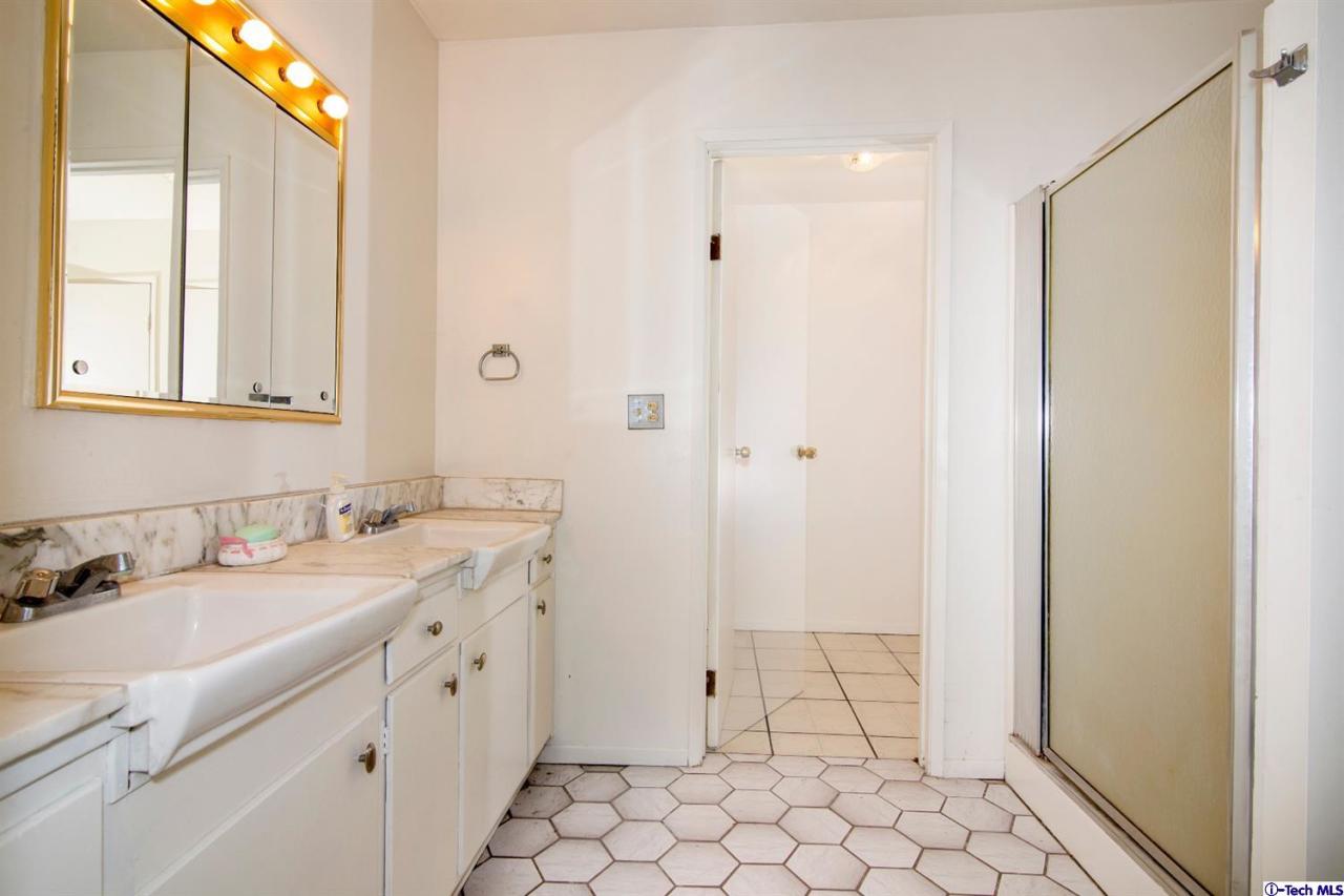 3263 Orlando Road Pasadena, CA 91107 - Photo 51 of 56 a bathroom with a sink and a mirror