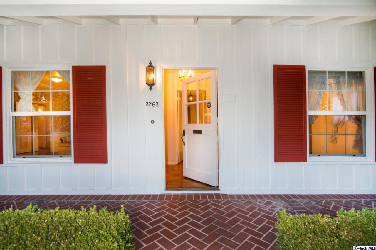 3263 Orlando Road Pasadena, CA 91107 - Photo 55 of 56 a front view of a house with a yard