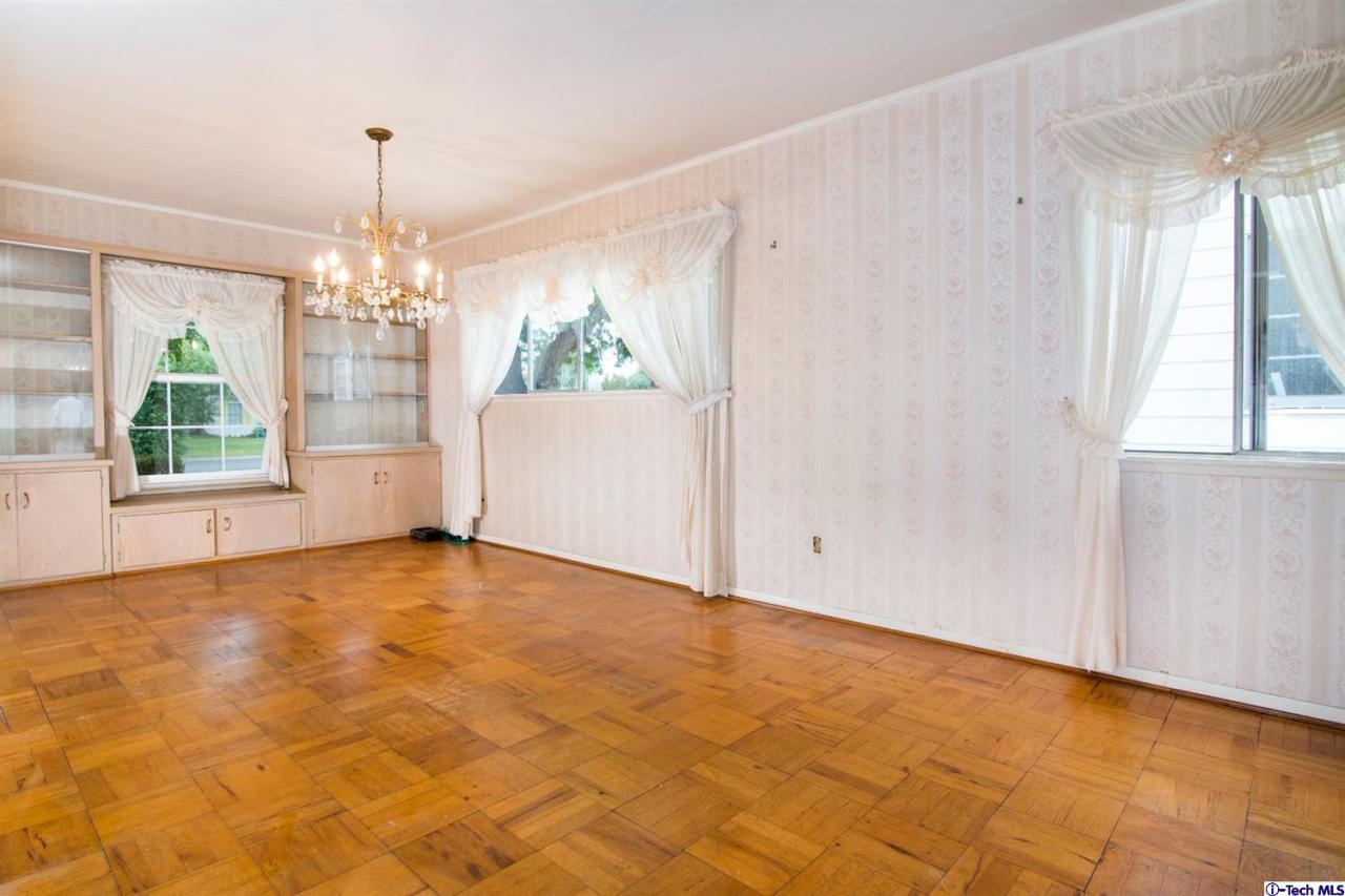 3263 Orlando Road Pasadena, CA 91107 - Photo 8 of 56 a view of an empty room with window and chandelier