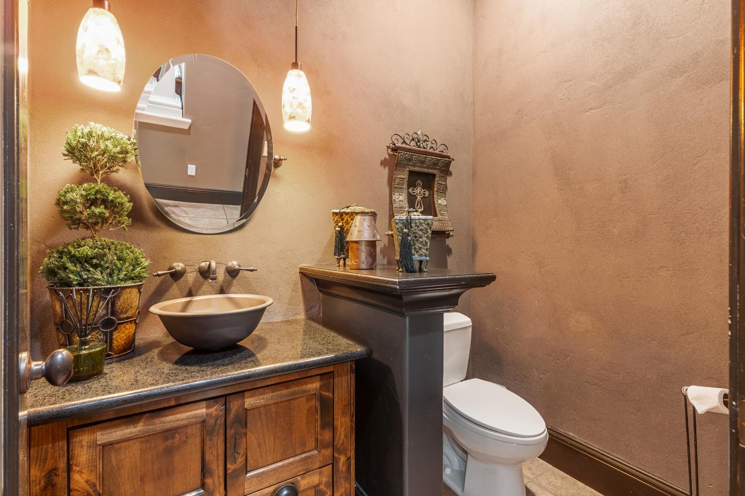29533 Chapman Way Escalon, CA 95320 - Photo 33 of 99 a bathroom with a toilet sink and mirror