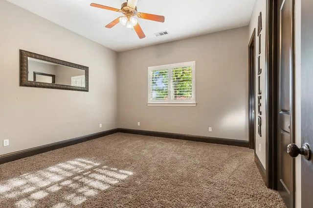 a view of a house with a backyard porch and sitting area