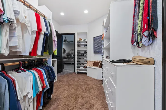 a view of a dining room with furniture and a floor to ceiling window