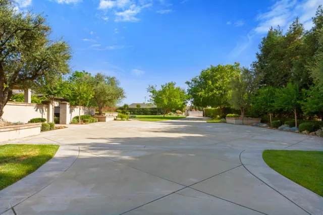 a front view of a house with a yard and a garage