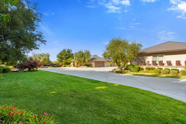 a lobby with furniture and a potted plant