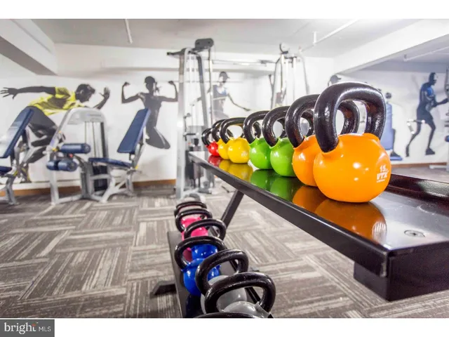 a living room with table gym equipment