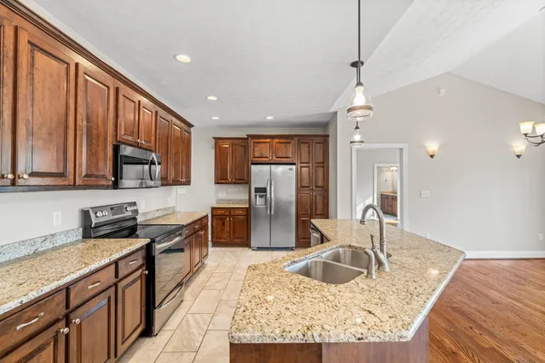 a kitchen with a sink and stove