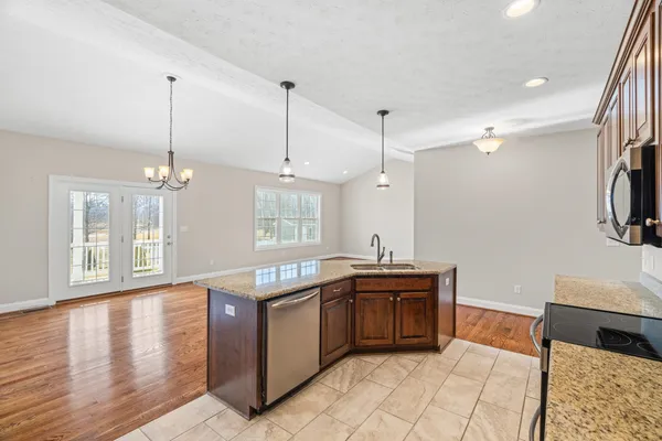 a view of a room with a large windows and chandelier