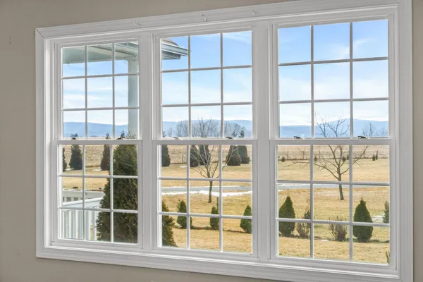 a kitchen with kitchen island granite countertop a stove and a wooden floor