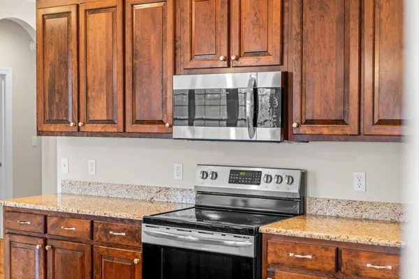 a view of a livingroom with wooden floor and a window