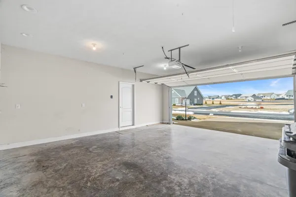 an aerial view of a residential houses with city view