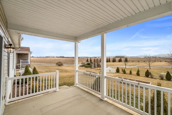 an aerial view of a house with lake view