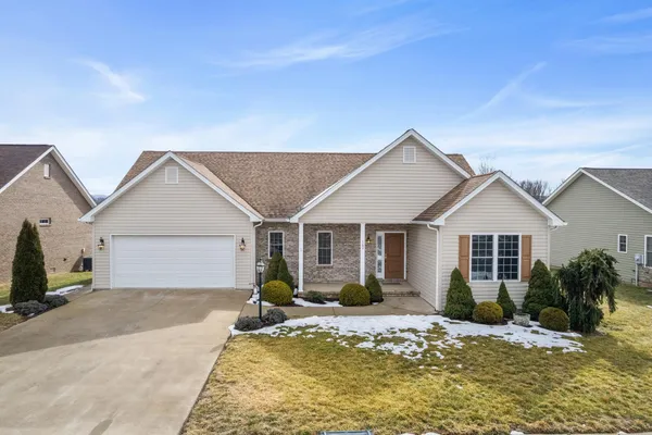 a large kitchen with granite countertop a large counter top stainless steel appliances and cabinets