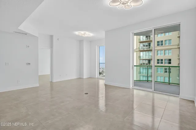 a view of an empty room with a window