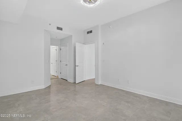 a bathroom with a double vanity sink mirror and a bathtub
