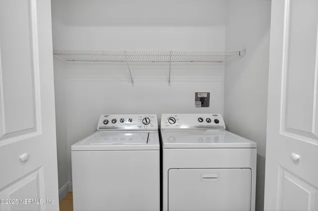 a view of a bathroom with a hallway to toilet