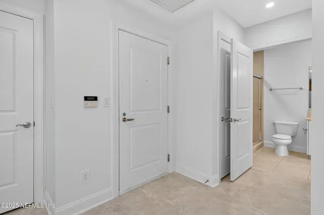 a room with a wooden floor and furniture