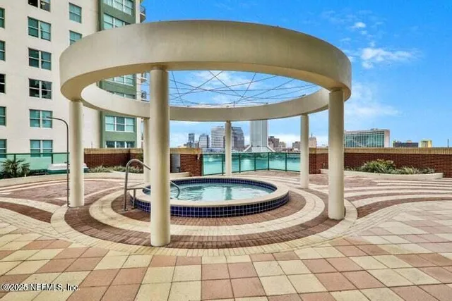 a swimming pool with outdoor seating