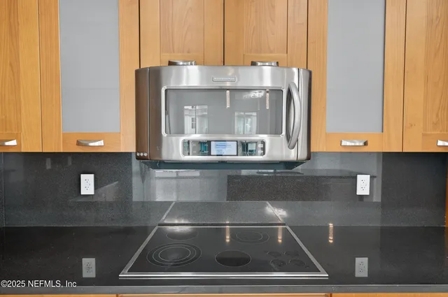 a kitchen with stainless steel appliances a sink stove and refrigerator