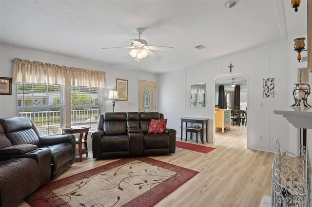a kitchen with stainless steel appliances a refrigerator a sink a stove and cabinets