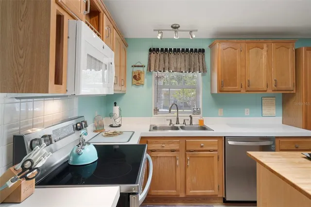 a view of a dining room with furniture and window