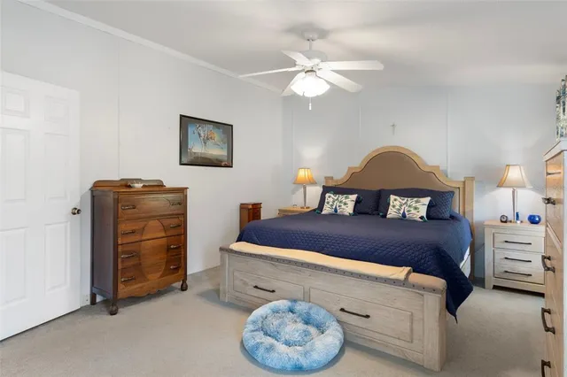 a bedroom with a bed and a table