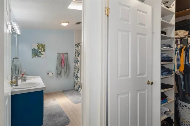 a bedroom with a bed and a closet