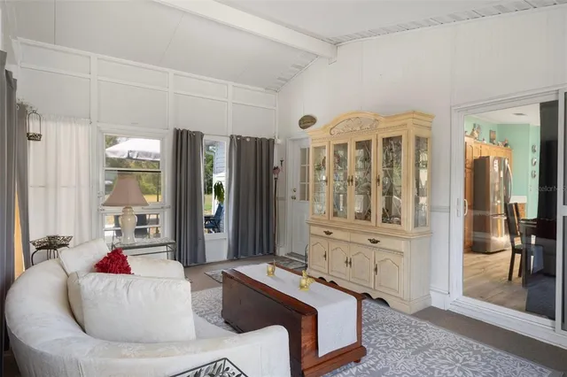 a view of backyard of house and trees