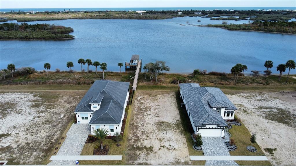 84 Coronado Road Flagler Beach, FL 32136 - Photo 2 of 15 an aerial view of residential houses with outdoor space