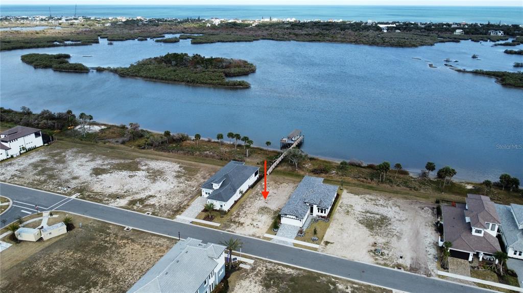84 Coronado Road Flagler Beach, FL 32136 - Photo 3 of 15 an aerial view of residential houses with outdoor space