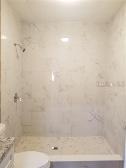 318 East Tarpon Avenue, Unit 5 Tarpon Springs, FL 34689 - Photo 12 of 16 a bathroom with a shower