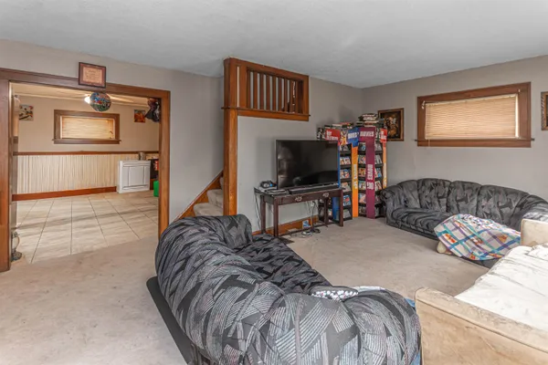a bedroom with a bed and a television