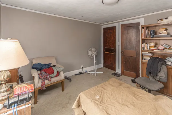 a bedroom with a bed and a window