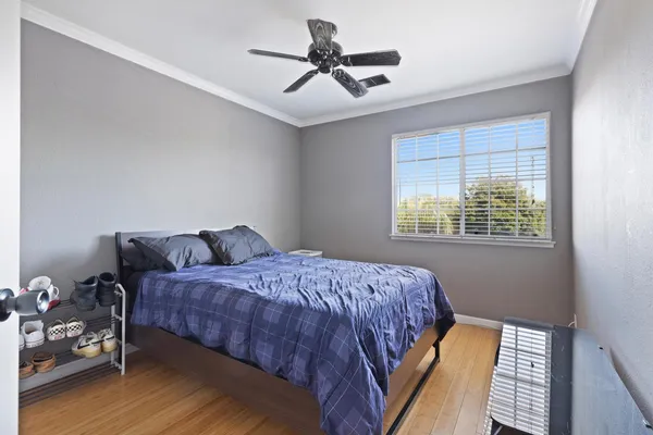 a bedroom with a bed and window