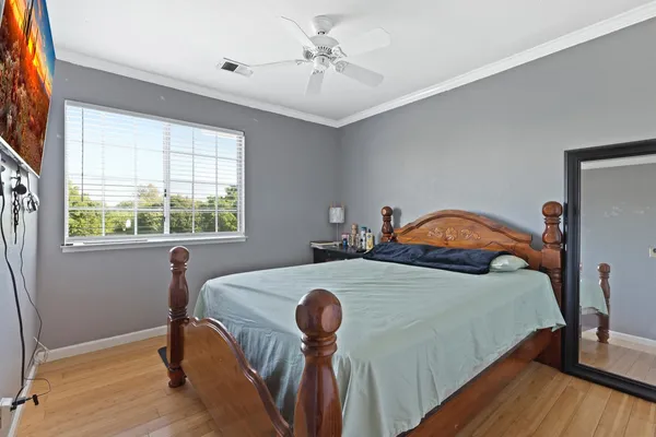 a bedroom with a bed and a table