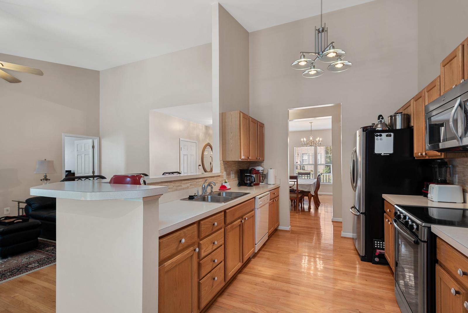 1453 Timber Ridge Circle Nashville, TN 37211 - Photo 14 of 30 The spacious kitchen features stainless steel appliances, designer backsplash, recessed lighting and upgraded cabinetry