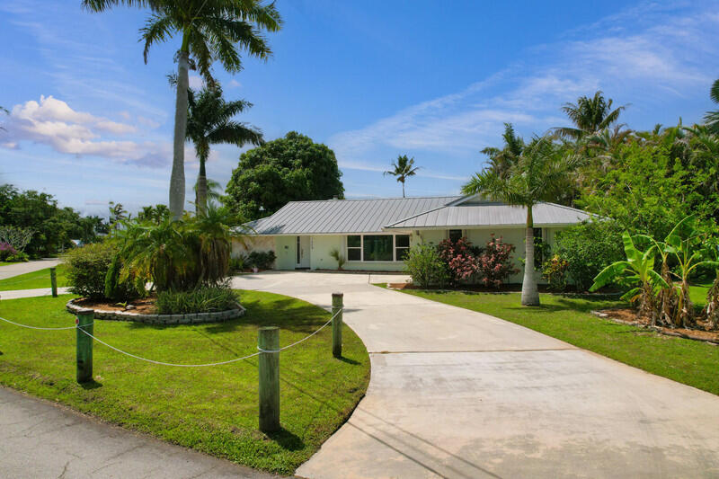 1209 Southwest Dyer Point Road Palm City, FL 34990 - Photo 52 of 56 front3.jpg-vsuniqueid-69e28a500e234