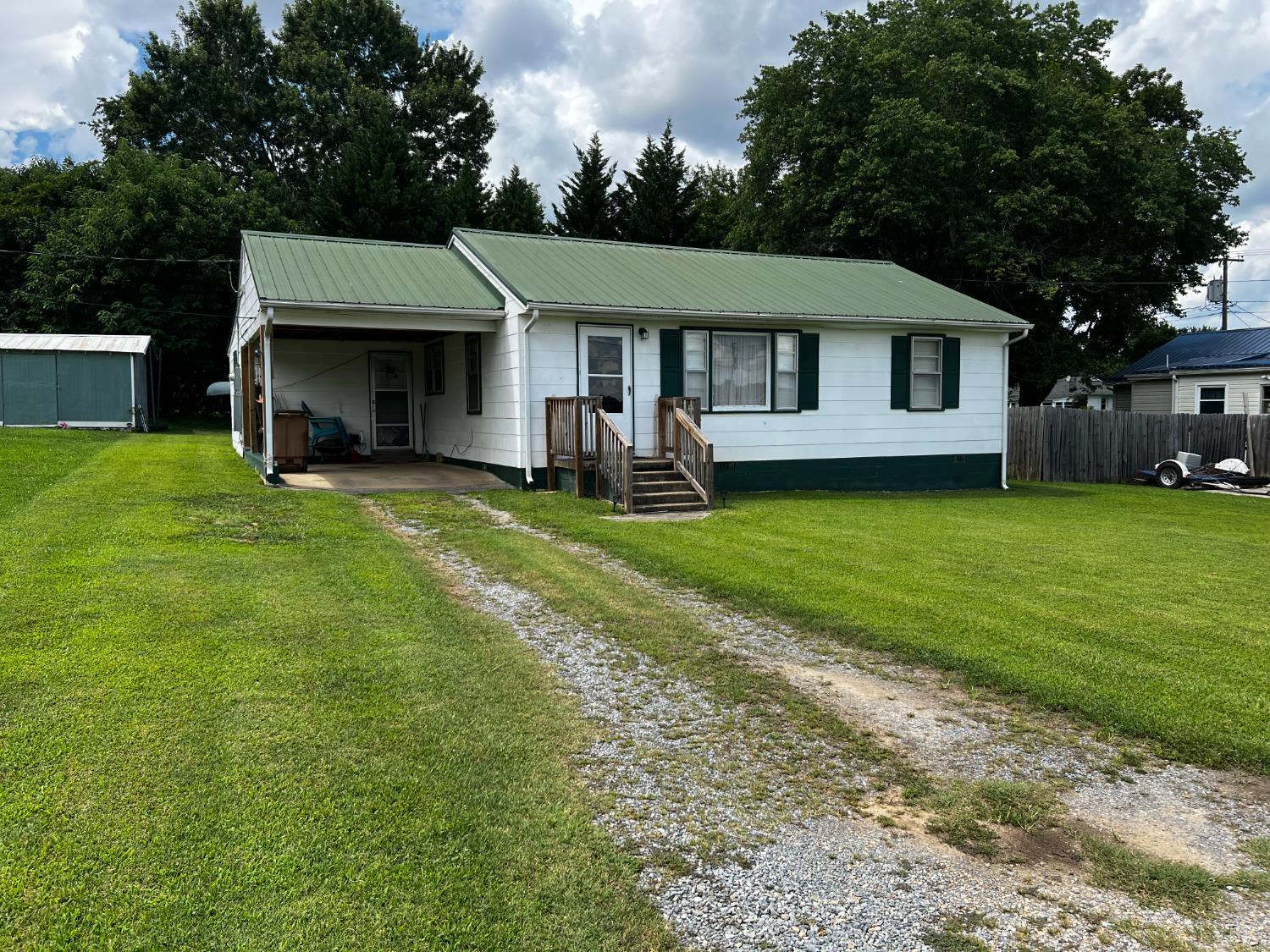 156 Doss Street Altavista, VA 24517 - Photo 2 of 15 a view of a house with a yard and sitting area
