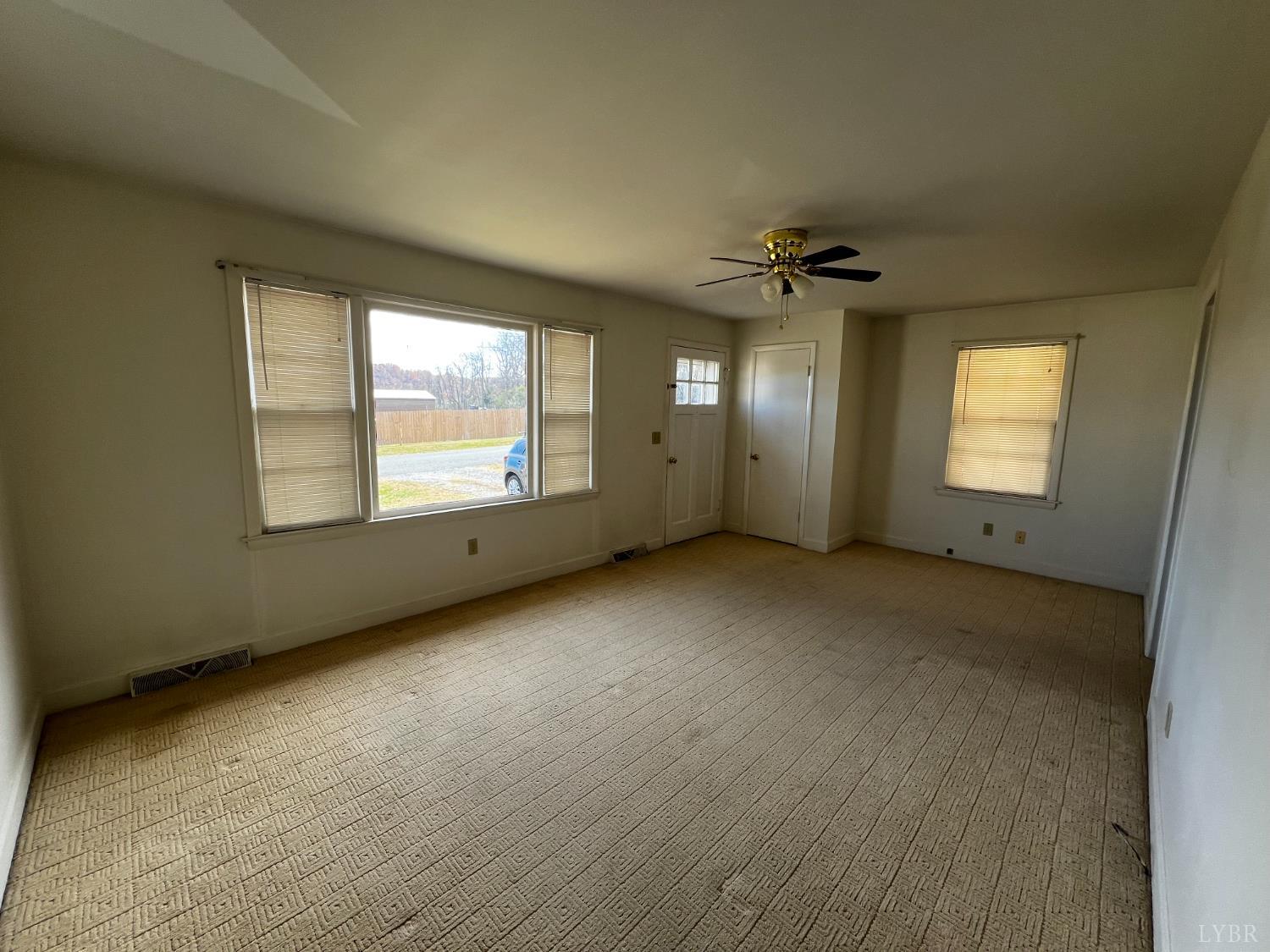 156 Doss Street Altavista, VA 24517 - Photo 7 of 15 a view of an empty room with a window