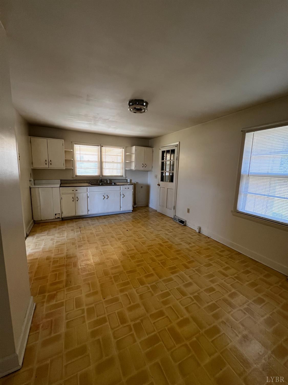 156 Doss Street Altavista, VA 24517 - Photo 9 of 15 a view of an empty room with a window