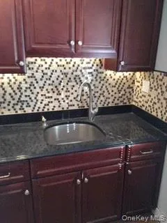 a close view of sink and cabinets