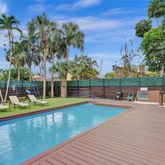 a view of a swimming pool with chairs
