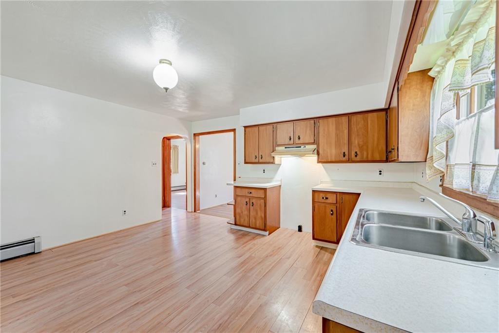 1598 Keystone Park Road New Alexandria, PA 15670 - Photo 11 of 28 a kitchen with wooden floors and wide window